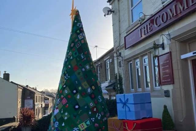 The 18-foot Christmas tree outside The Commercial Inn