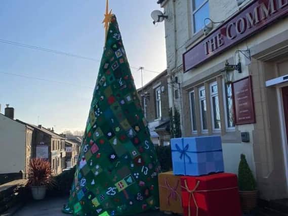 The 18-foot Christmas tree outside The Commercial Inn