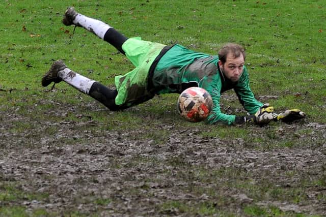 Bardsey goalkeeper Will Beddard manages to tip the ball around the post and his efforts helped his side to a 3-1 victory over visiting table toppers, Kirkstall Crusadery. Picture: Steve Riding.