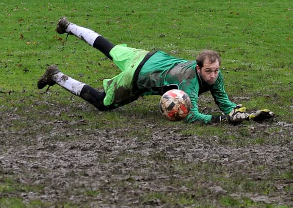 Bardsey goalkeeper Will Beddard manages to tip the ball around the post and his efforts helped his side to a 3-1 victory over visiting table toppers, Kirkstall Crusadery. Picture: Steve Riding.