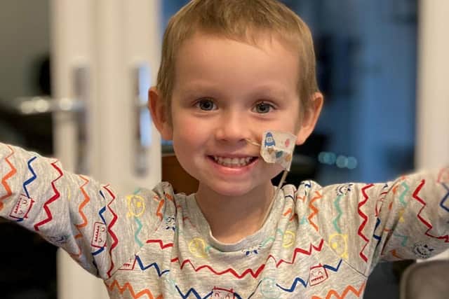 The mum of a cancer-stricken little boy has received the "best Christmas present ever" after raising a whopping £270,000 to pay for pioneering treatment in the US.
SWNS