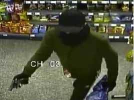 Robber was captured on CCTV footage armed with pistol during raid at Wellstone Rise Post Office, Swinnow