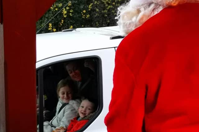 Santa saying hello to the children at the drive-thru Santa experience at the Gaping Goose in Garforth.