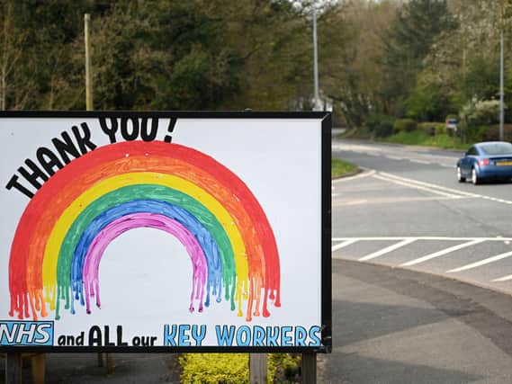 A Thank You NHS sign  (Photo by OLI SCARFF/AFP via Getty Images).