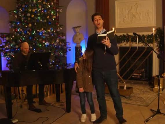 Albert Chait and his daughter celebrating the first night of Chanukah at Harewood House