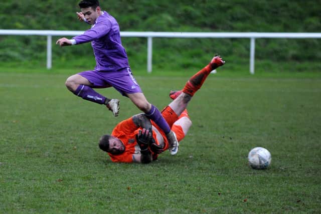 Alex Diaz is thwarted by Lower Hopton goalkeeper Craig Roberts. Picture: Steve Riding.