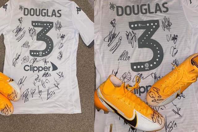 Barry Douglas has donated his signed promotion winning Leeds United shirt and a pair of signed boots to help the Mission Christmas toy appeal.