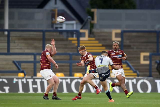 FETCH THAT ONE OUT: Leeds Rhinos' Luke Gale kicks the winning drop goal against Huddersfield Giants at Headingley in early August. Picture: Martin Rickett/PA
