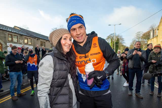 Kevin Sinfield is congratulated by his wife, Jayne, after his seventh marathon in as many days. Picture by Bruce Rollinson.