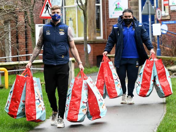 Leeds Rhinos' Alex Mellor, left and Konrad Hurrell arrive at Leeds Children's Hospital with sacks of gifts for young patients. Picture by Gary Longbottom/JPIMedia.