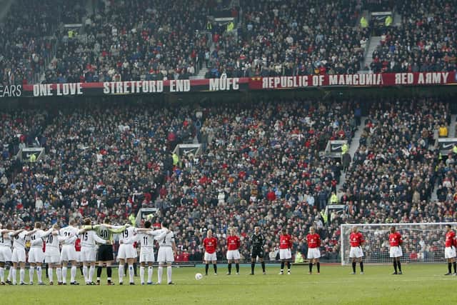 WE'RE BACK: Leeds United and Manchester United observe a minute's silence in memory of John Charles at Old Trafford in the last league meeting between the two clubs back in February 2004. Photo by Laurence Griffiths/Getty Images.
