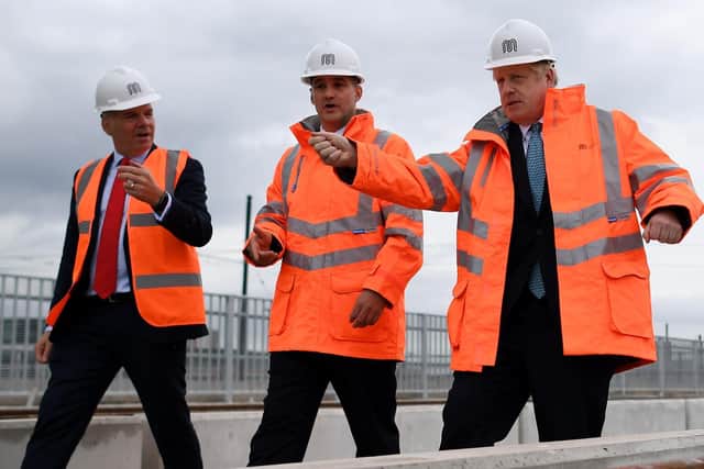 Chief executive of Trasnport for the North Barry White (left) with Prime Minister Boris Johnson (right), and then Northern Powerhouse Minister Jake Berry. Photo: Getty