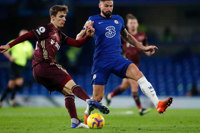 BACK IN TRAINING: Leeds United's Spanish international centre-back Diego Llorente, left, pictured facing Chelsea's Olivier Giroud on his Whites debut in this month's 3-1 loss at Stamford Bridge. Photo by Matthew Childs - Pool/Getty Images.