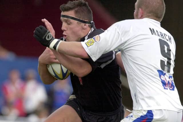 Andy Last, left, in action as a player for Hull against Trinity in 2003. Picture by Bruce Rollinson.