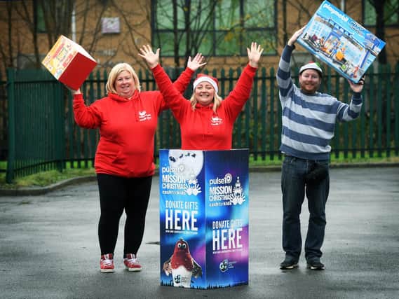 Staff from Mission Christmas celebrate after another successful Christmas campaign.
From left, Lisa Sullivan, Lauren Procter, and Eddie Thompson.

Picture : Jonathan Gawthorpe