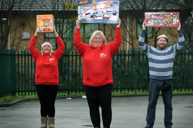 Staff from Mission Christmas celebrate after another successful Christmas campaign.
From left, Lauren Procter, Lisa Sullivan and Eddie Thompson.

Picture : Jonathan Gawthorpe