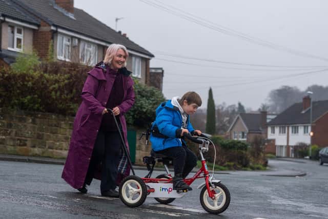 Luke Andrews, aged nine , from Meanwood has Down's syndrome and learning and physical disabilities.  The 50 year old PhysCap charity bought Luke a specialist £1,182 trike and a £680 car seat which his mum Cherie says have been life changing for Luke.

Picture: James Hardisty