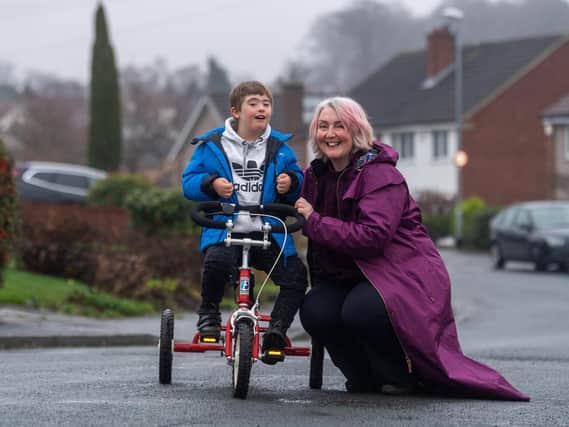 Luke Andrews, aged nine, from Meanwood has Down's syndrome and learning and physical disabilities.  The 50 year old PhysCap charity bought Luke a specialist £1,182 trike and a £680 car seat which his mum Cherie says have been life changing for Luke.

Picture: James Hardisty