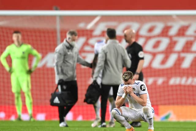 PAINFUL: Gjanni Alioski and Whites keeper Illan Meslier, back left, show their hurt during Sunday's heavy defeat at Manchester United. Photo by Michael Regan/Getty Images.
