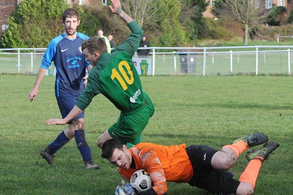 Wykebeck Arms goalkeeper Adam Wilson saves from Ash Parker of Hunslet Club Sundays First. Picture: Steve Riding.