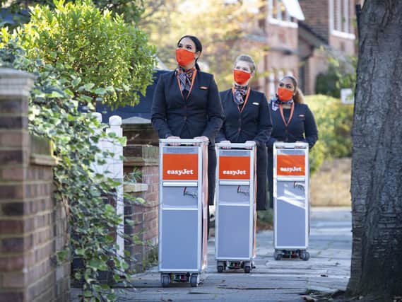 Library image of cabin crew celebrating easyJet's 25th birthday