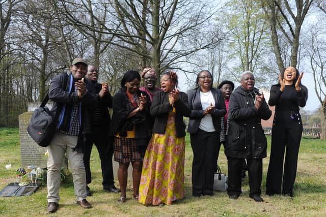 Representatives of the Nigerian Community Leeds Trio sing by the graveside of David Oluwale in Killingbeck Cemetery during an event of remembrance in April 2019 marking 50 years since his death.

 Picture Tony Johnson.
