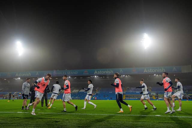 Leeds United's players warm-up at an empty Elland Road. Pic: Bruce Rollinson