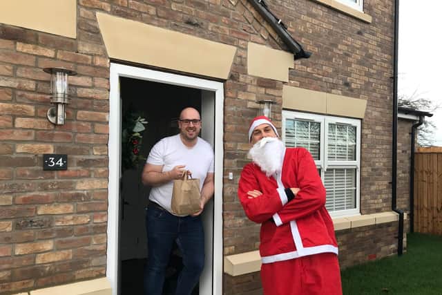 Journey Further managing director Matt Kwiecinski  delivering  Christmas presents to members of the company's team in and around Leeds