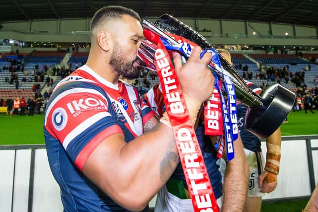 Zane Tetevano drinks from the Betfred World Club Challenge trophy in 2019 while representing Sydney Roosters after the victory against Wigan. Picture: Allan McKenzie/SWpix.com.