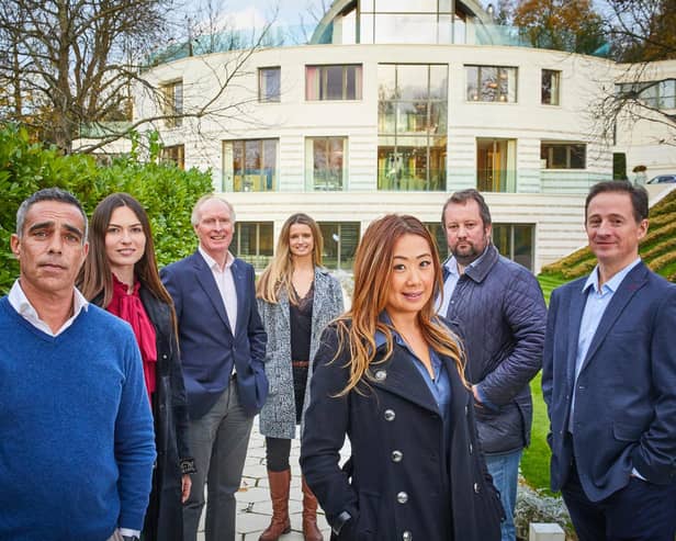 Agents from Sotheby International Realty outside a £40m home that features in Channel 4's Britain's Most Expensive Houses