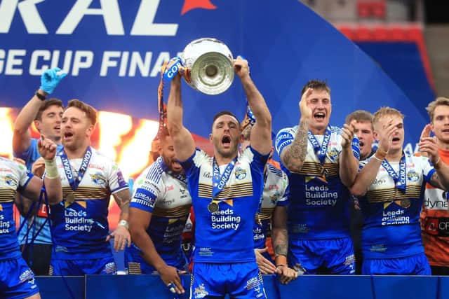 Leeds Rhinos’ Luke Gale lifts the Coral Challenge Cup trophy. Picture: Mike Egerton/PA