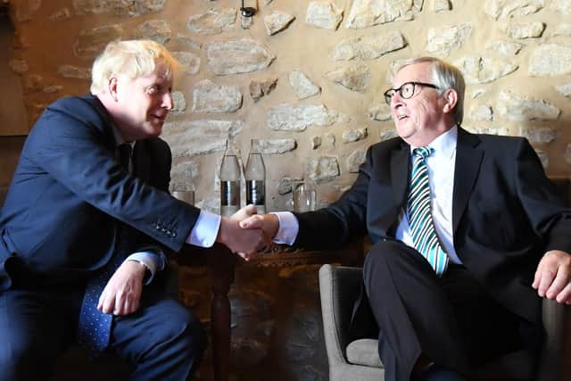 File photo dated 16/09/19 of Prime Minister Boris Johnson with European Commission President Jean-Claude Juncker, inside Le Bouquet Garni restaurant in Luxembourg, prior to a working lunch on Brexit. The UK and EU have reached a post-Brexit trade agreement (photo: PA).