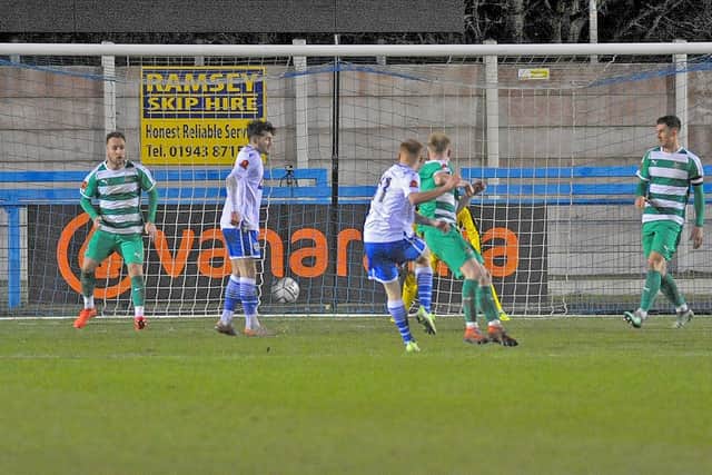 Nathan Powell scores for Guiseley to make the score 2-2 against Farsley Celtic. Picture: Steve Riding.