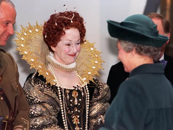 Actress Una Stubbs, in a costume of Queen Elizabeth 1, meets Queen Elizabeth 2 during her visit to Leeds for the opening of The Royal Armouries in March 1996.