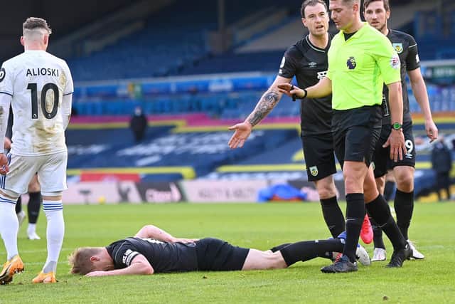 Burnley players complain over the decision to rule out a potential levelling goal. Pic: Getty