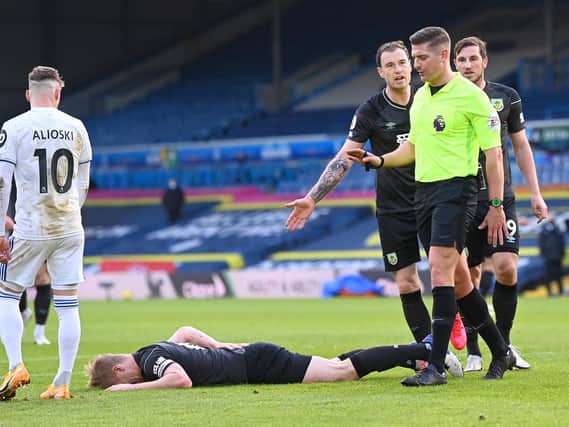 Burnley players complain over the decision to rule out a potential levelling goal. Pic: Getty