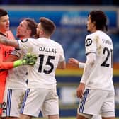 Leeds United goalkeeper Illan Meslier is congratulated by Luke Ayling and Stuart Dallas. Picture: Nigel French/PA Wire.