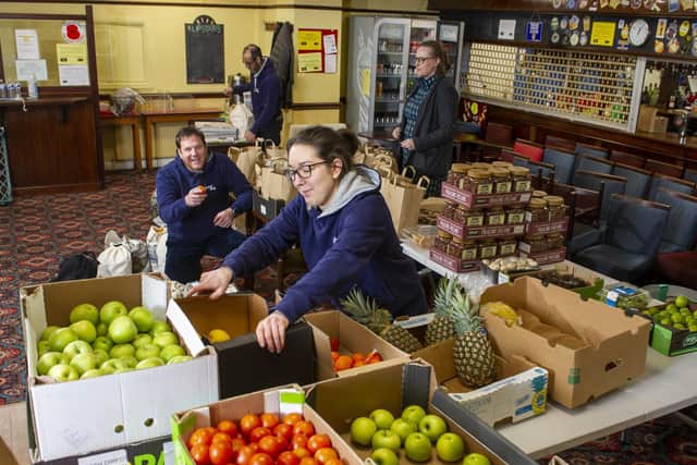 Slung Low Theatre Company staff pack food parcels. Picture: Tony Johnson
