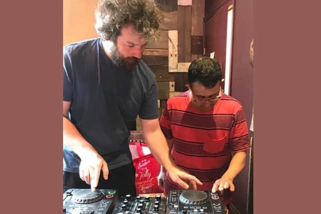 Leeds DJ James Heselwood doing DJ practice with participant Israr Abbas.