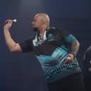 Devon Petersen in action against Gary Anderson. Picture by Lawrence Lustig/PDC.