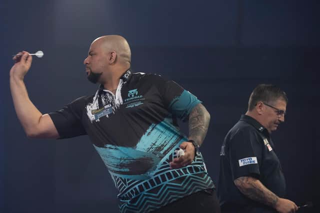 Devon Petersen in action against Gary Anderson. Picture by Lawrence Lustig/PDC.