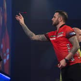 Joe Cullen takes aim against Michael van Gerwen. Picture by Lawrence Lustig/PDC.