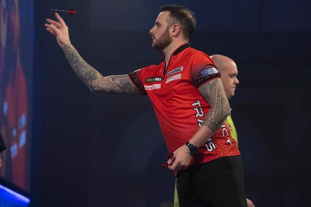 Joe Cullen takes aim against Michael van Gerwen. Picture by Lawrence Lustig/PDC.