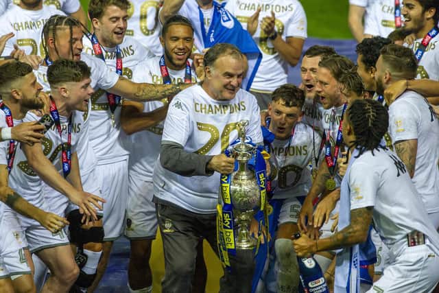 Leeds United head coach Marcelo Bielsa lifts the Championship trophy. Pic: Tony Johnson