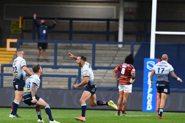 Luke Gale celebrates his golden-point drop goal against Huddersfield at Emerald Headingley last August. Picture by James Hardisty.