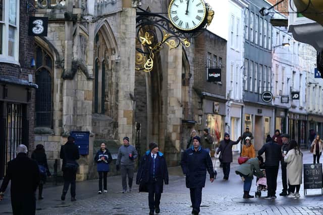Shoppers walk through York City Centre. More than three quarters of England's population is being ordered to stay at home to stop the spread of coronavirus though York and North Yorkshire are in Tier 3. PA Photo