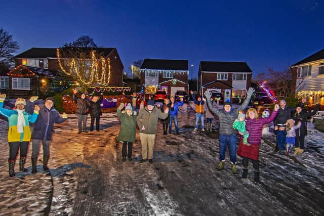 Residents of Farnham Close have raised money for charity by decorating their homes for Christmas.
