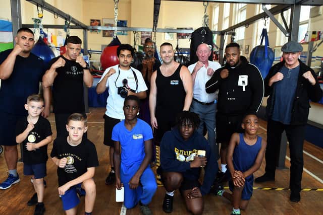 Lee Murtagh(centre) pictured at the Bethlehem Boxing Club in Leeds in August 2019 with some of the people that took part in his film 'Staight'ner', including British, Commonwealth and European Champion Crawford Ashley (back centre) and Steve Ward, 63, the oldest pro boxer in the world (right in cap)

Picture: Gary Longbottom