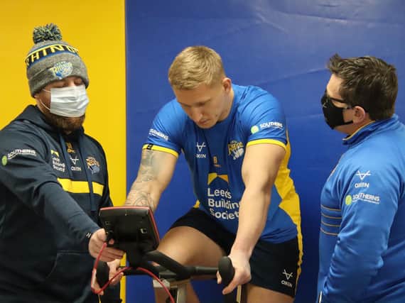 Prop Mikolaj Oledzki was put through his paces by Dan Weaving, left and Jason Davidson - of Rhinos' backroom staff - when pre-season began today. Picture by Phil Daly.