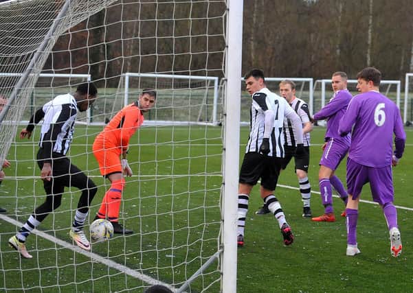 Ras Diamond clears off the line for Stanley United against Leeds Medics and Dentists. Picture: Steve Riding.